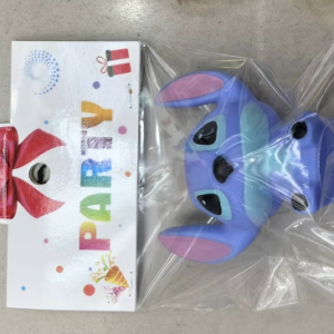 Two mixed cake decorations, Stitch