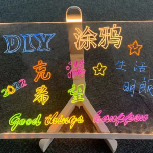 Hand-drawn glowing acrylic billboard (center)