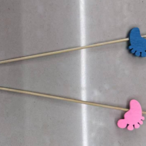 Blue-painted bamboo skewers with pink feet